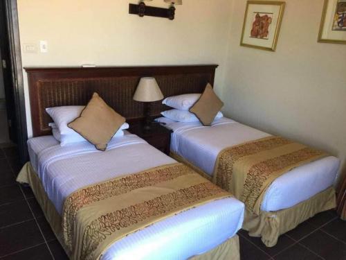 أسرة-ثنائية-توأم-في-منتجع-فندق-بورتو-ساوث-بيتش-العين-السخنة-جوائز-شركة-الحرية-للحلول-التسويقية-والعقارية